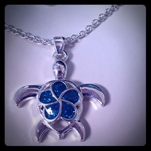 Turtle necklace with flower on its back